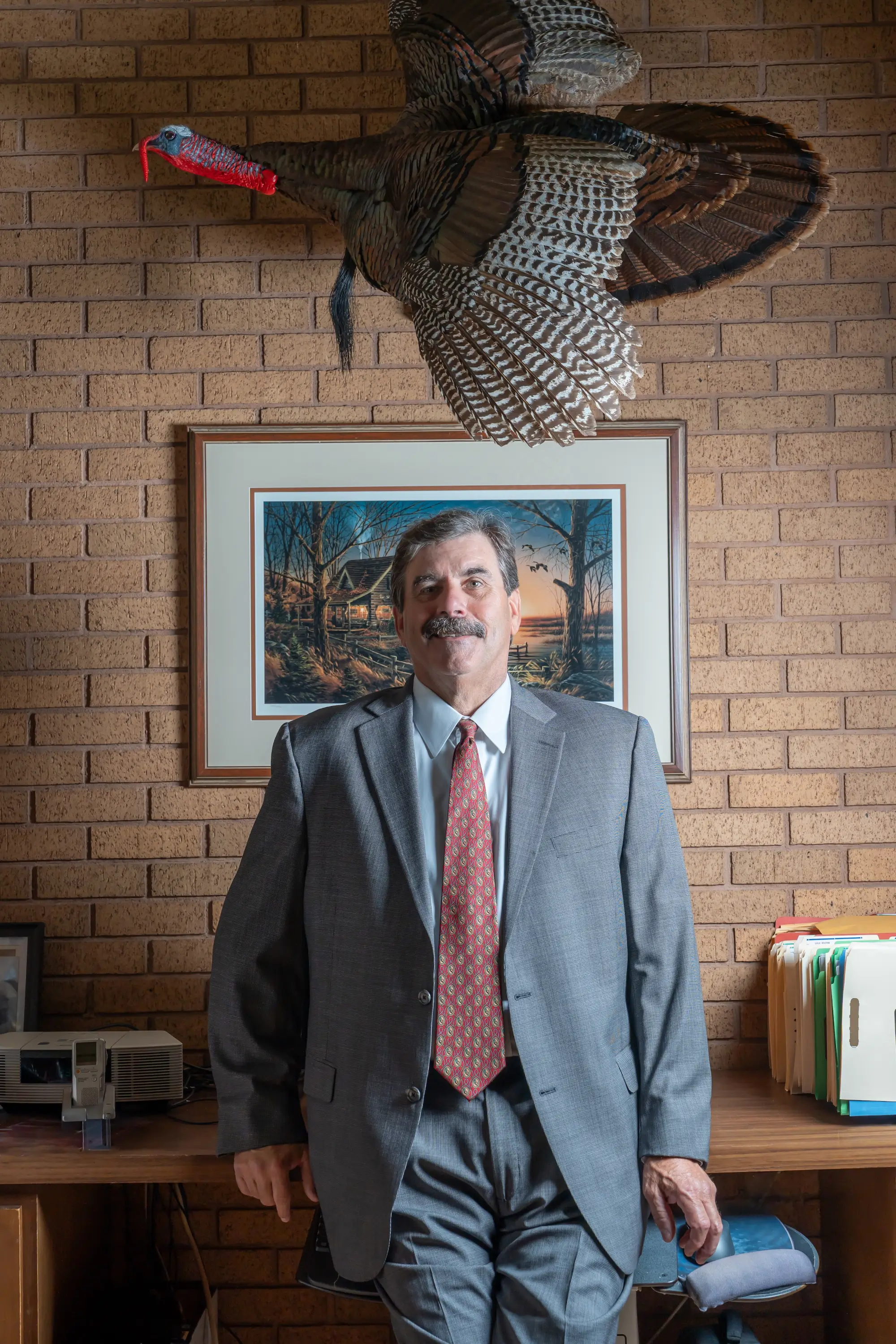 John Doyle Nalley, attorney at Lovell, Nalley & Nalley, standing at his desk